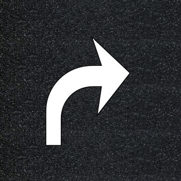 White preformed thermoplastic right turn arrow pavement marking on asphalt background, 2-piece FHWA right turn symbol
