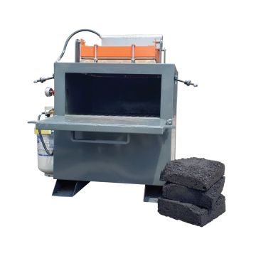 Front view of the MR2X2 Mini Asphalt Recycler showing open chamber and stacked asphalt chunks