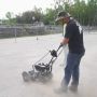 William of Windy City Blacktop trying the Hedgehog Asphalt Crack Cleaner'