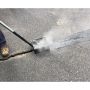 Applying Pure Asphalt Mastic PL oil-jacketed mastic asphalt sealant to fill a crack in asphalt pavement
'