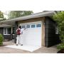 Painter using Titan Impact X 120 18V backpack sprayer to spray a garage door'
